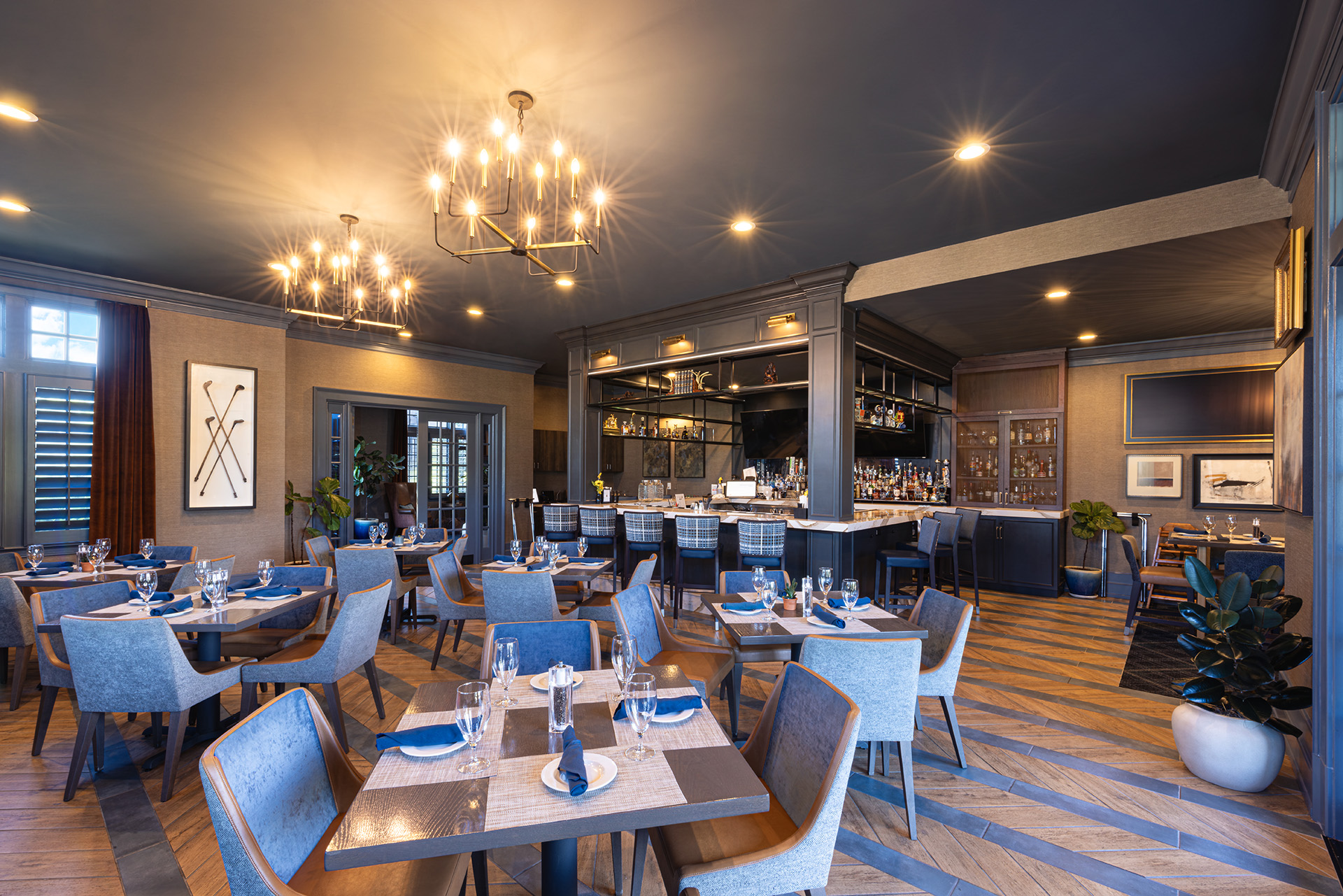 Renovated dining and bar interior at Longview Country Club featuring warm wood finishes and custom details by Ossa Studio.