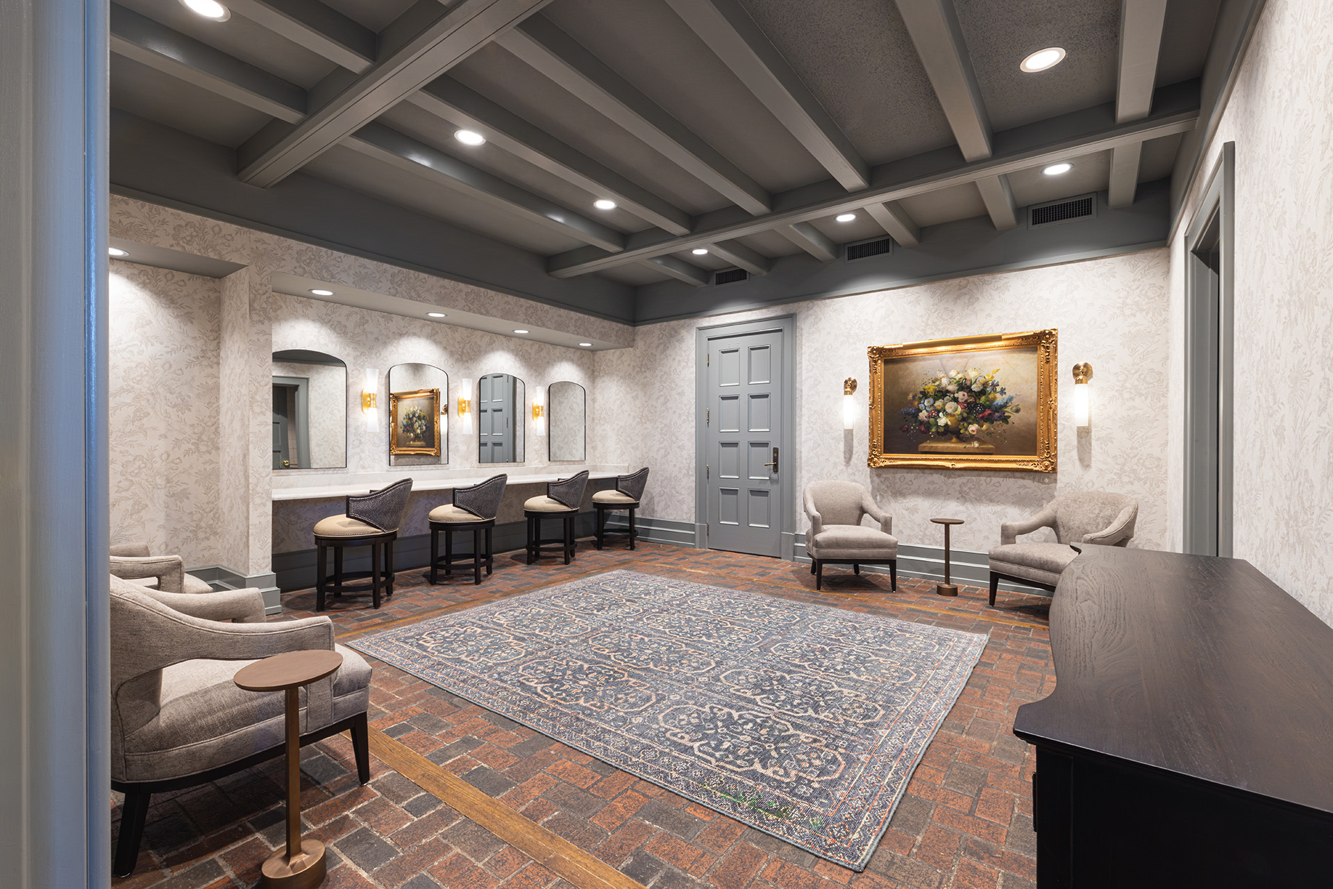 Renovated lounge at Longview Country Club featuring custom millwork, coffered ceiling, and seating by Ossa Studio.