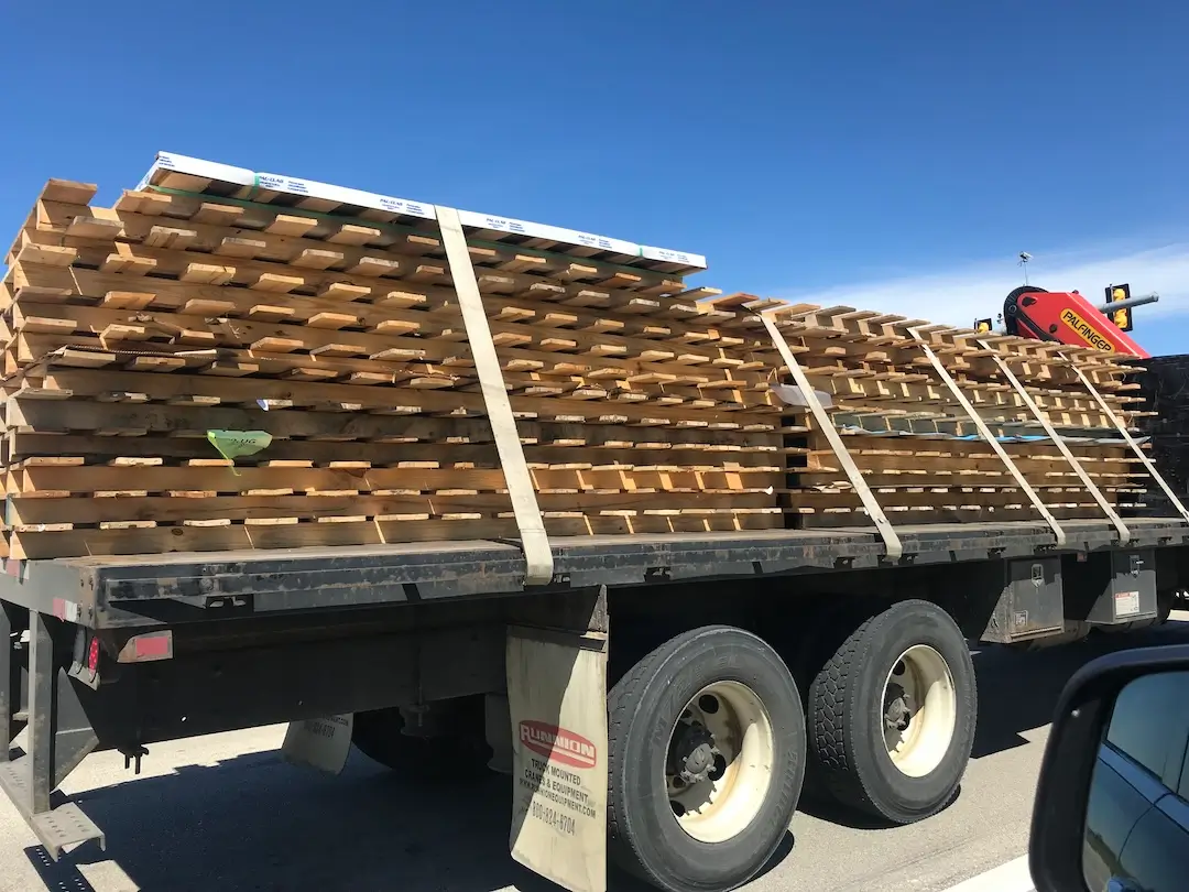 Metal manufacturer returning excess wooden pallets to supplier 