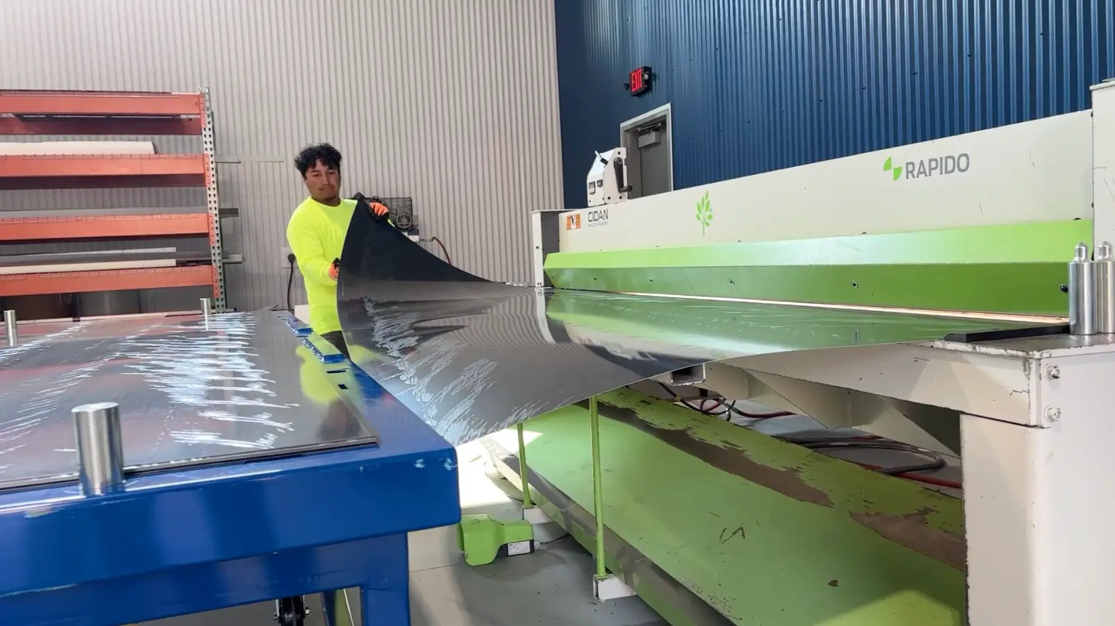 sheet metal being placed onto material storage cartridge