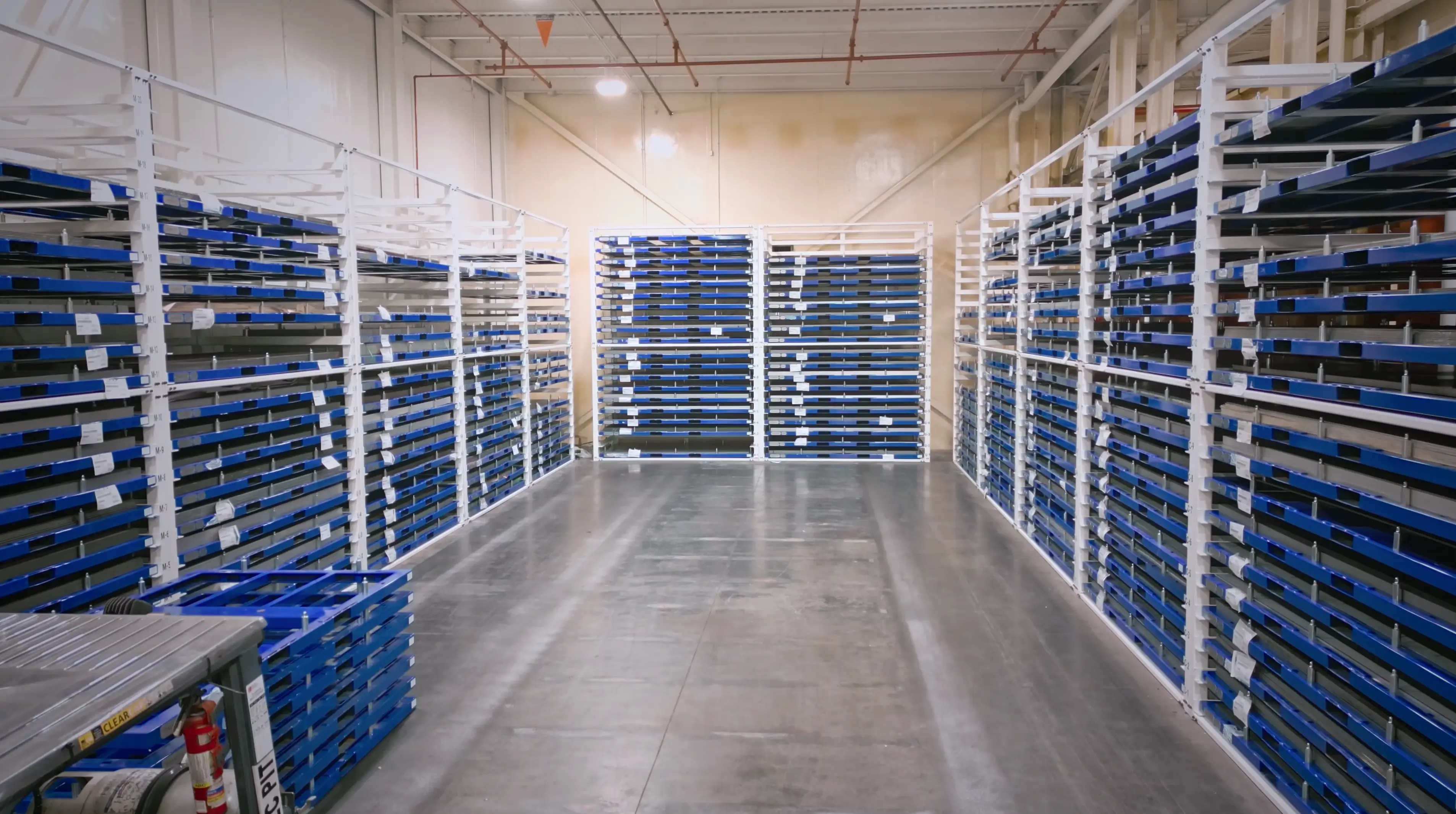 Sheet metal storage racks that minimize operational waste