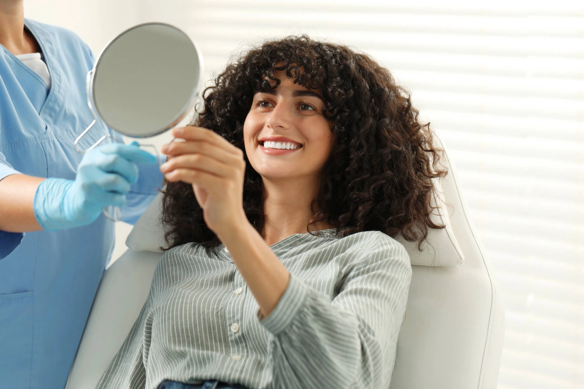 Woman happy with her veneers sterling va