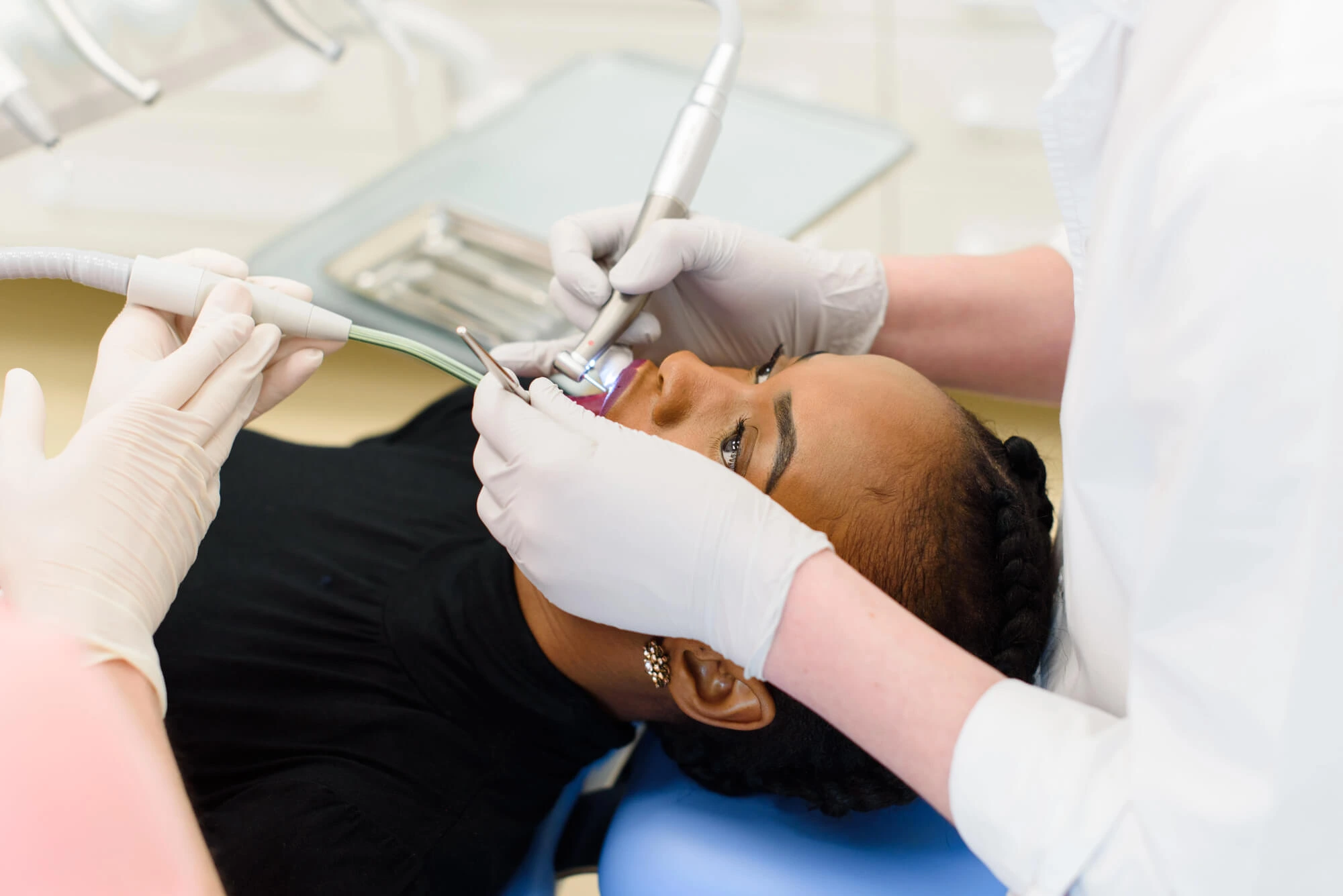 woman getting teeth cleaning in fairfax