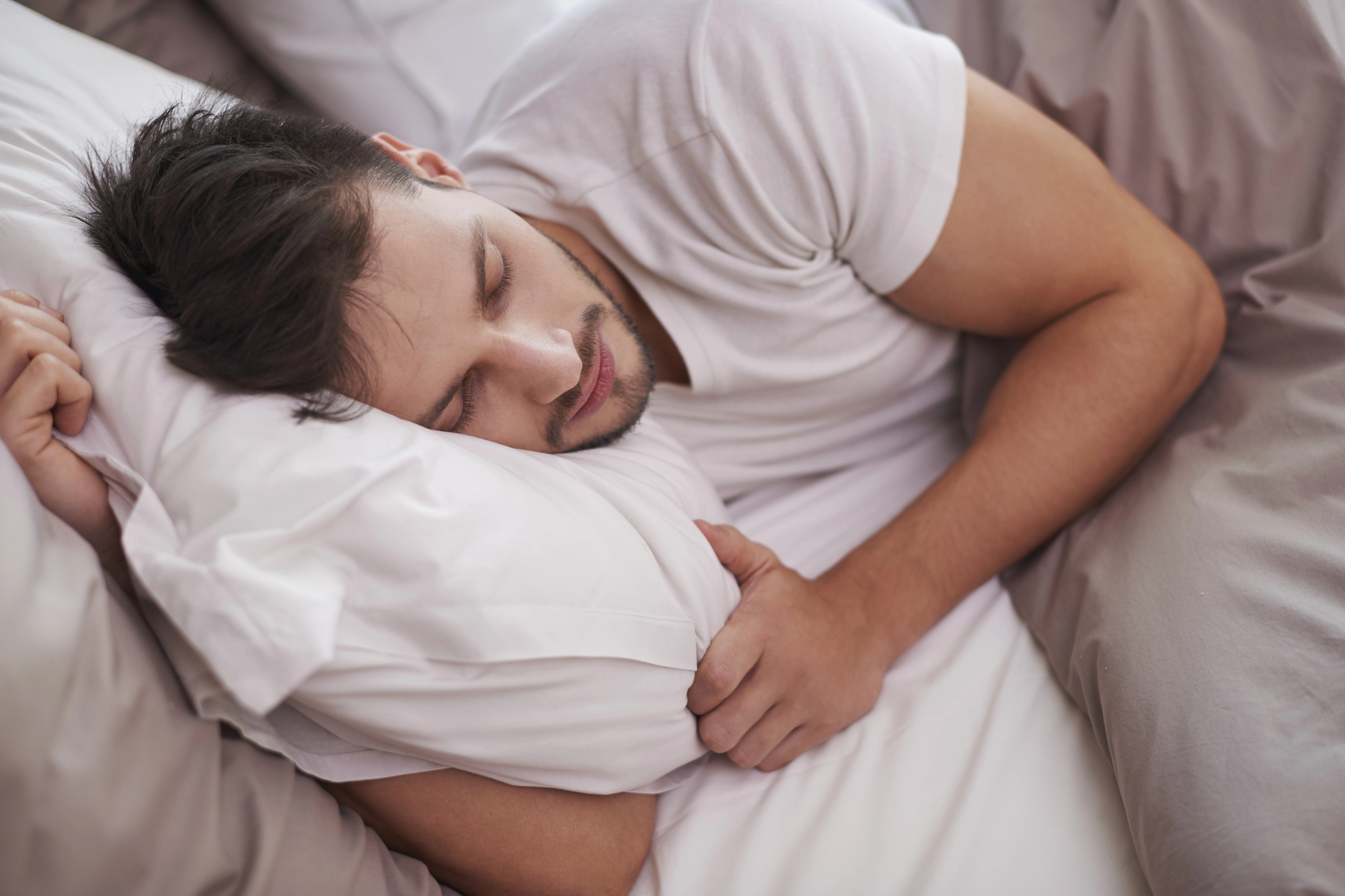 For patients who'd rather not deal with a CPAP mask every night, oral appliance therapy is often the first alternative their dentist brings up. But an "oral appliance" isn't a single device. Dentists typically choose between two designs: a mandibular advancement device or a tongue stabilizing device, and each keeps your airway open in a different way. If you're exploring sleep apnea without CPAP, it helps to understand how the two compare before your oral appliance therapy consultation. What Is a Mandibular Advancement Device (MAD)? A mandibular advancement device, or MAD, is the most widely prescribed type of oral appliance for obstructive sleep apnea. It fits over your upper and lower teeth like a two-piece mouthguard and gently holds your lower jaw in a slightly forward position throughout the night. That small shift keeps the base of your tongue and the soft tissue in your throat from collapsing backward and blocking your airway. Most MADs are also adjustable, so your dentist can fine-tune how far forward the jaw sits as you get used to wearing it. Who MADs Tend to Work Best For MADs are generally a good fit for patients with mild to moderate obstructive sleep apnea who have enough healthy teeth to anchor the appliance. Because the device relies on your jaw and teeth for support, your dentist will check your bite, jaw joints, and dental health before recommending one. What Is a Tongue Stabilizing Device (TSD)? A tongue stabilizing device takes a different approach. Instead of moving your jaw, a TSD uses a small suction bulb to hold the tip of your tongue forward, which keeps the base of your tongue from falling back into your airway as you sleep. Who TSDs Tend to Work Best For Because a TSD doesn't rely on your teeth or jaw joints for support, it can be a useful alternative for patients who aren't good candidates for a MAD. TSDs are often recommended for patients with limited teeth, dentures, or existing jaw joint issues that make jaw-repositioning devices uncomfortable. Which Option Is Right for You? There's no single "better" appliance, so the right choice depends on your anatomy, dental health, and how your body responds to each design. When comparing the two, your dentist will typically weigh: Whether you have enough healthy teeth to support a MAD Any history of jaw pain, clicking, or TMJ symptoms How each device feels and fits during a trial period Ease of cleaning and daily wear Selecting the right candidate for each device type plays a major role in how effective the treatment ends up being. If you're already dealing with symptoms like snoring that might signal sleep apnea, a proper evaluation is the best next step before choosing either device. Find Your Fit for Sleep Apnea Without CPAP in Fairfax Whether a mandibular advancement device or a tongue stabilizing device makes more sense for you, the only way to know for sure is through a proper evaluation and custom fitting. Our team at Fairfax Dental Esthetics can walk you through both options and help you find a comfortable, effective way to sleep better without a CPAP machine. Reach out to us to schedule a consultation and take the next step toward restful sleep.