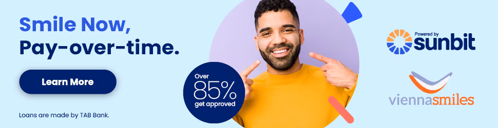 Smiling man in yellow sweater pointing to his face with text 'Smile Now, Pay-over-time.' and over 85% approval rate, with Sunbit and Vienna Smiles logos.