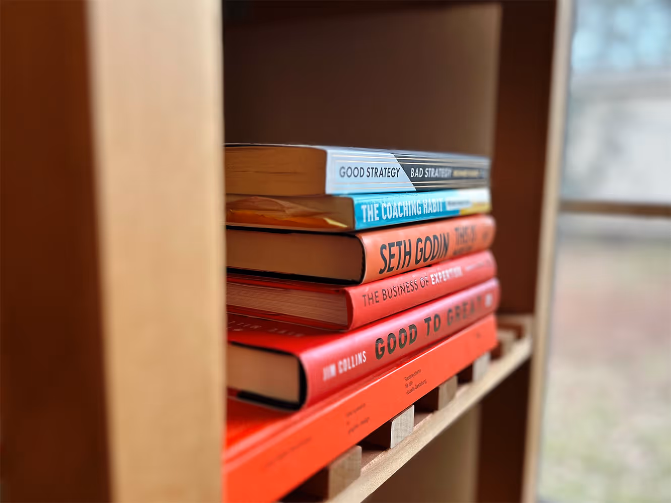 Books stacked on bookshelf