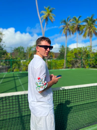 Mykyta with the phone on Maldives