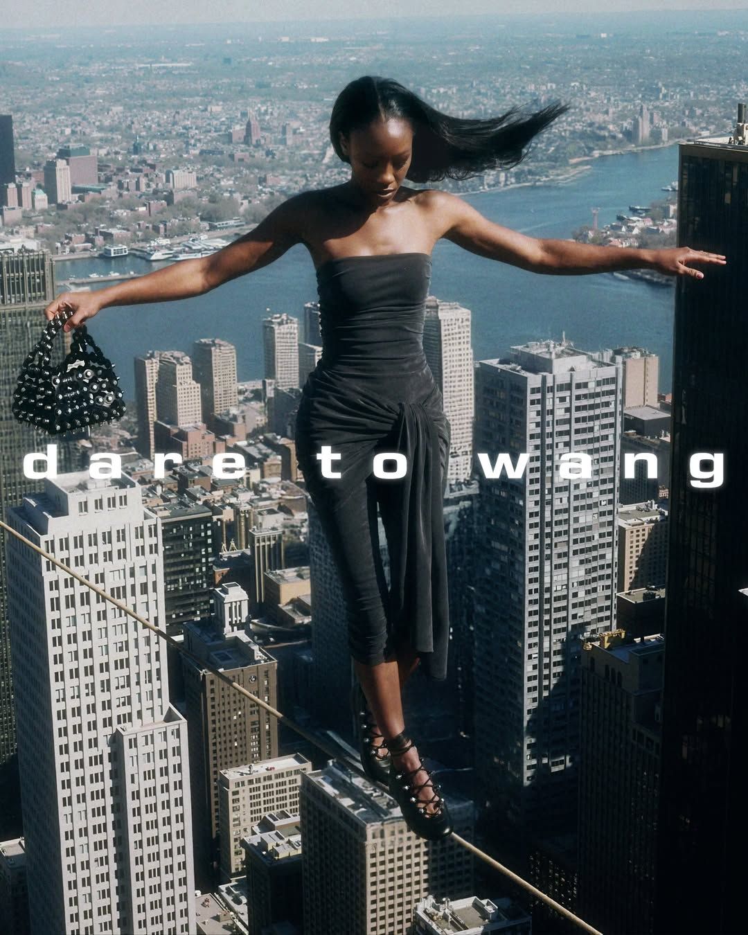 Woman balancing above a city skyline