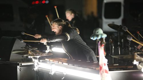 A musician playing a Marimba