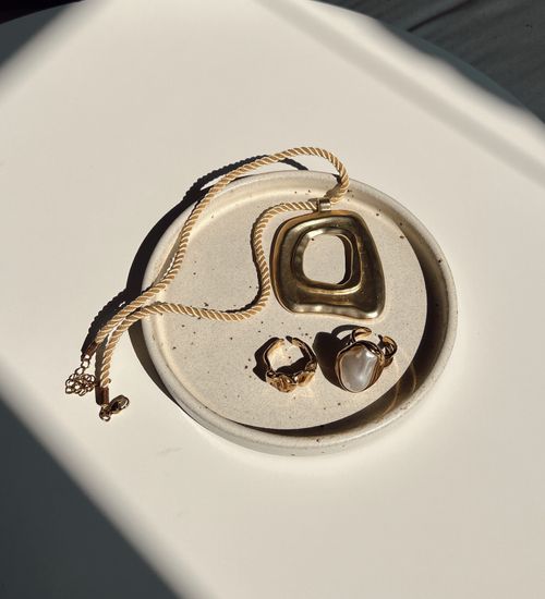 Golden jewelry on a plate