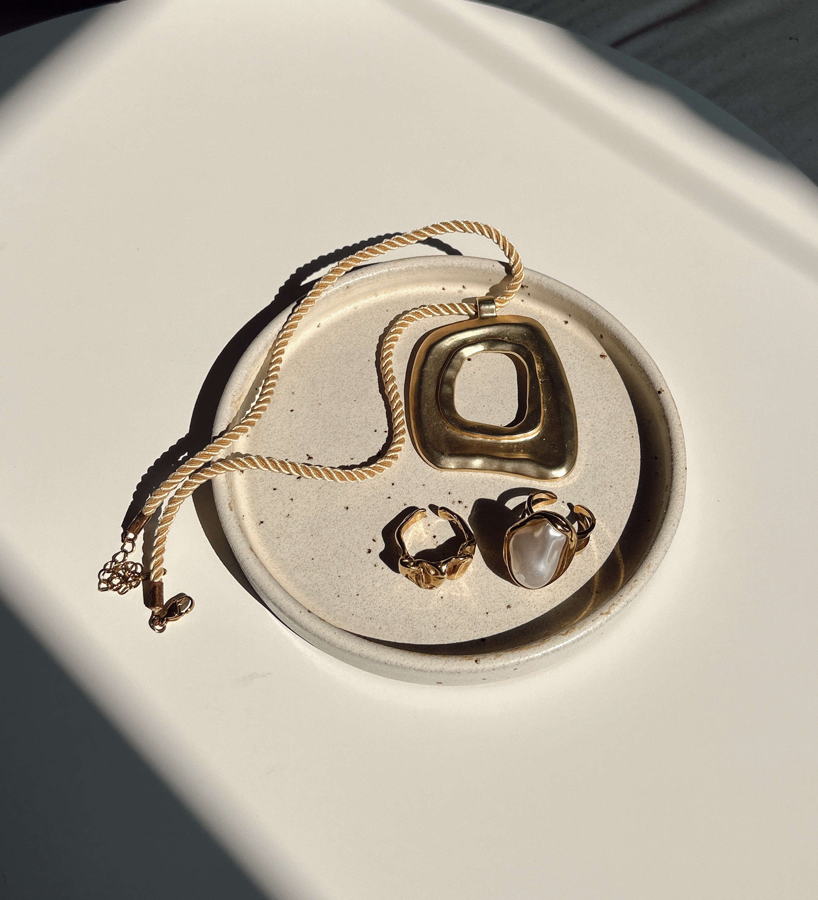 Golden jewelry on a plate