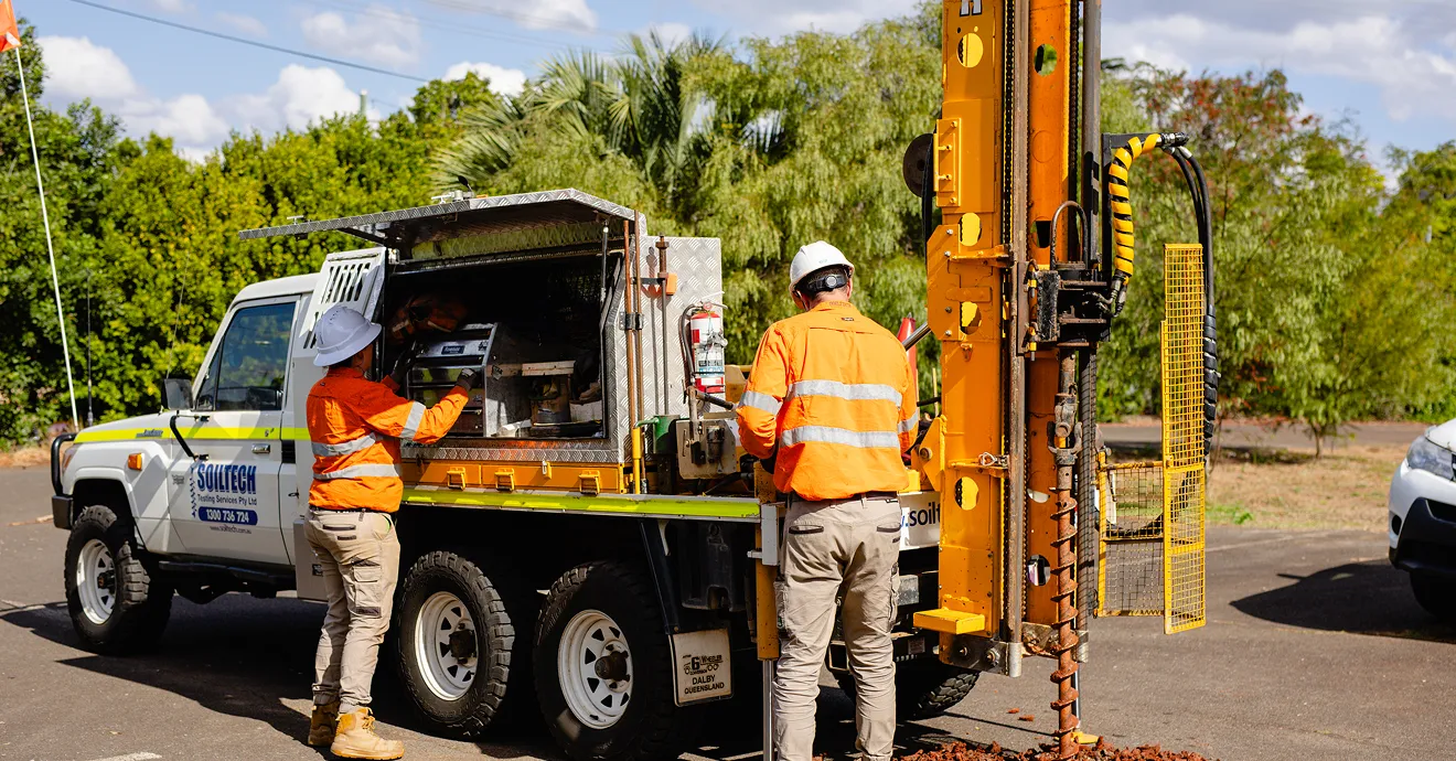 Soiltech testing truck and field technicians carrying out on-site soil analysis operations