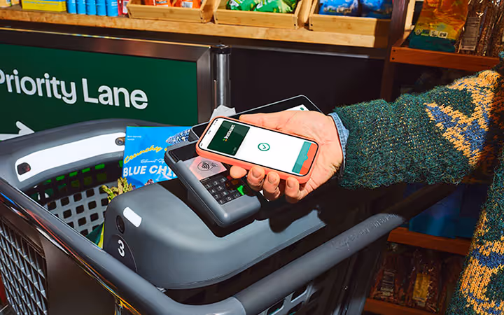 Customer paying on Caper Cart