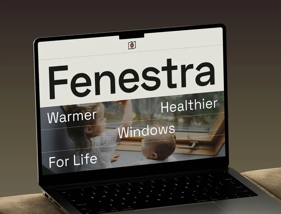 Laptop screen showing "Fenestra" branding with tagline "Warmer, Healthier Windows For Life" overlaid on an image of a person looking through a window