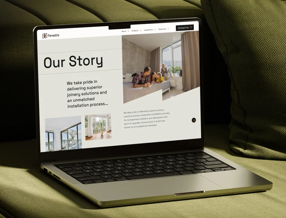 Laptop on green couch with minimalist website on display