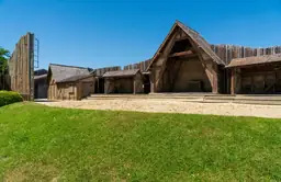 Reconstructed wooden buildings at Fort Raleigh National Historic Site, reflecting historical architecture.