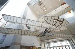 Replica of the Wright brothers' airplane suspended in the atrium of the North Carolina Museum of History.