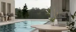 Serene poolside setting at Kingston Plantation Condos with a clear view of a tranquil lake, showcasing a modern outdoor relaxation area.