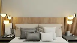 Elegantly styled Days Inn Raleigh hotel room with plush bedding, hanging spherical lamps, and a modern bedside table.