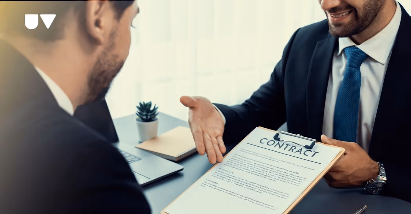 A pair of hands holding a rental agreement document.