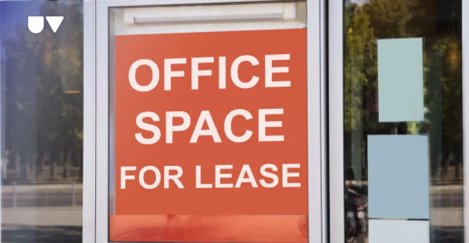 A sign board with “OFFICE SPACE FOR LEASE” text.