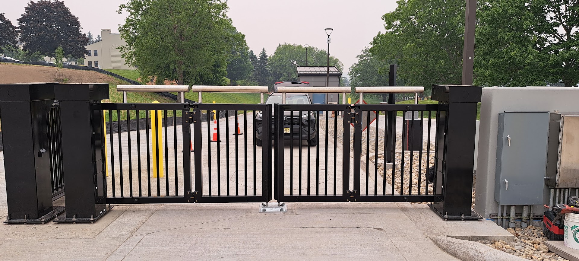 Bavak bi-folding security gate at a controlled vehicle entrance in the United States