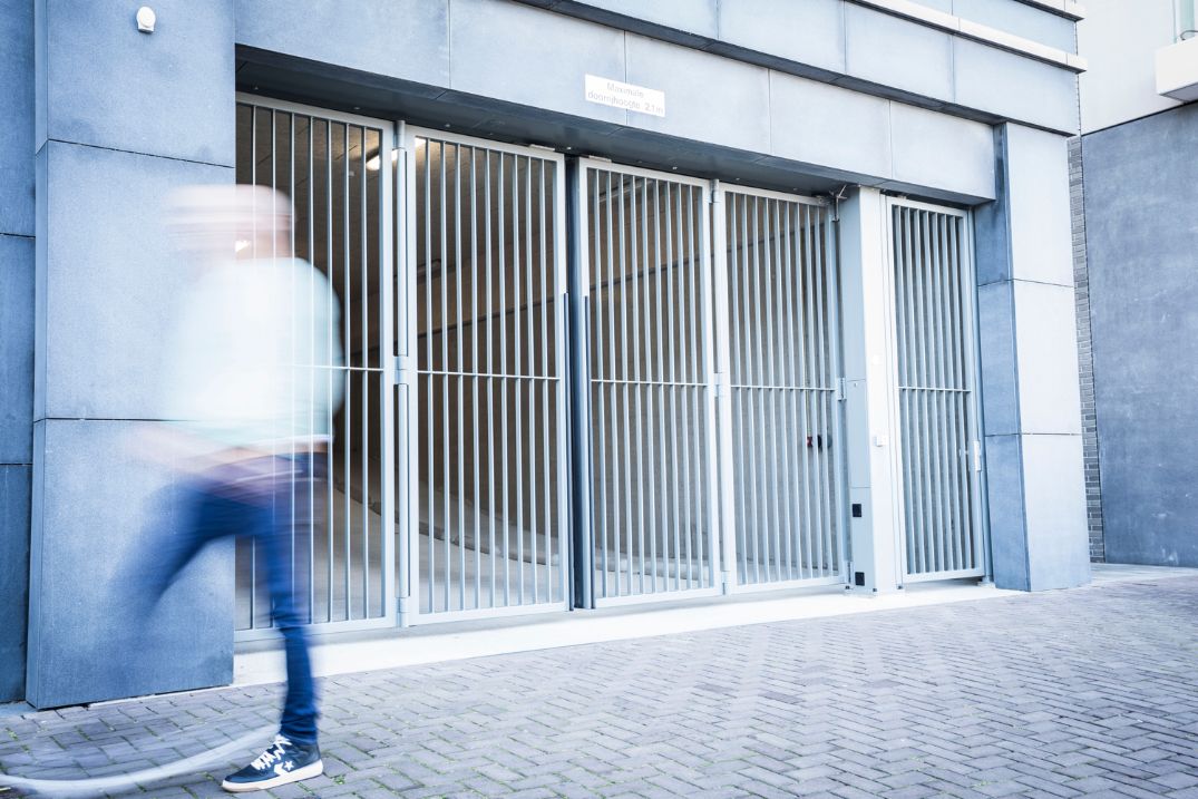 Bavak bi-folding security gate at a controlled vehicle entrance