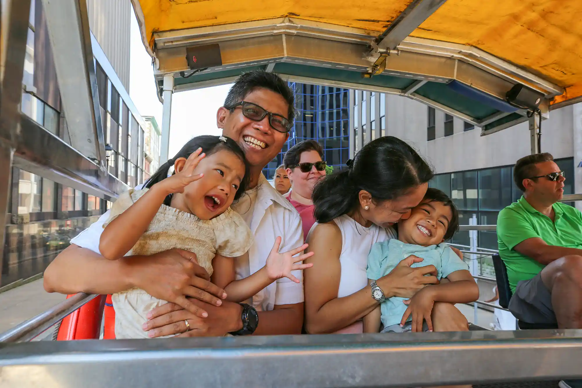 A family of four enjoy their experience on the Harbour Hopper Tour.