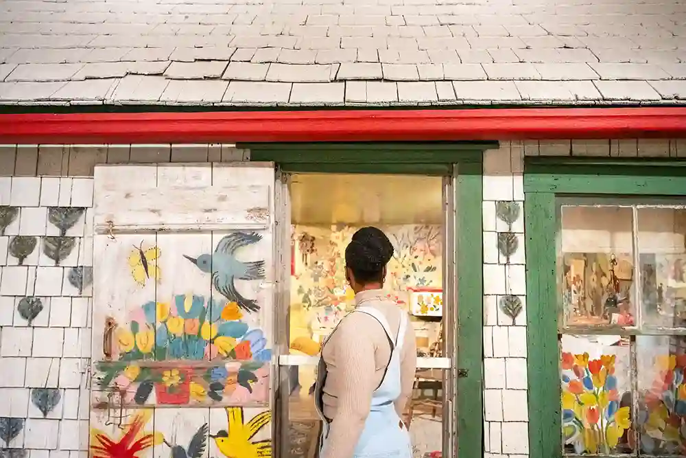 An art lover views Maude Lewis' bright and colourful home which now lives at the Art Gallery of Nova Scotia.