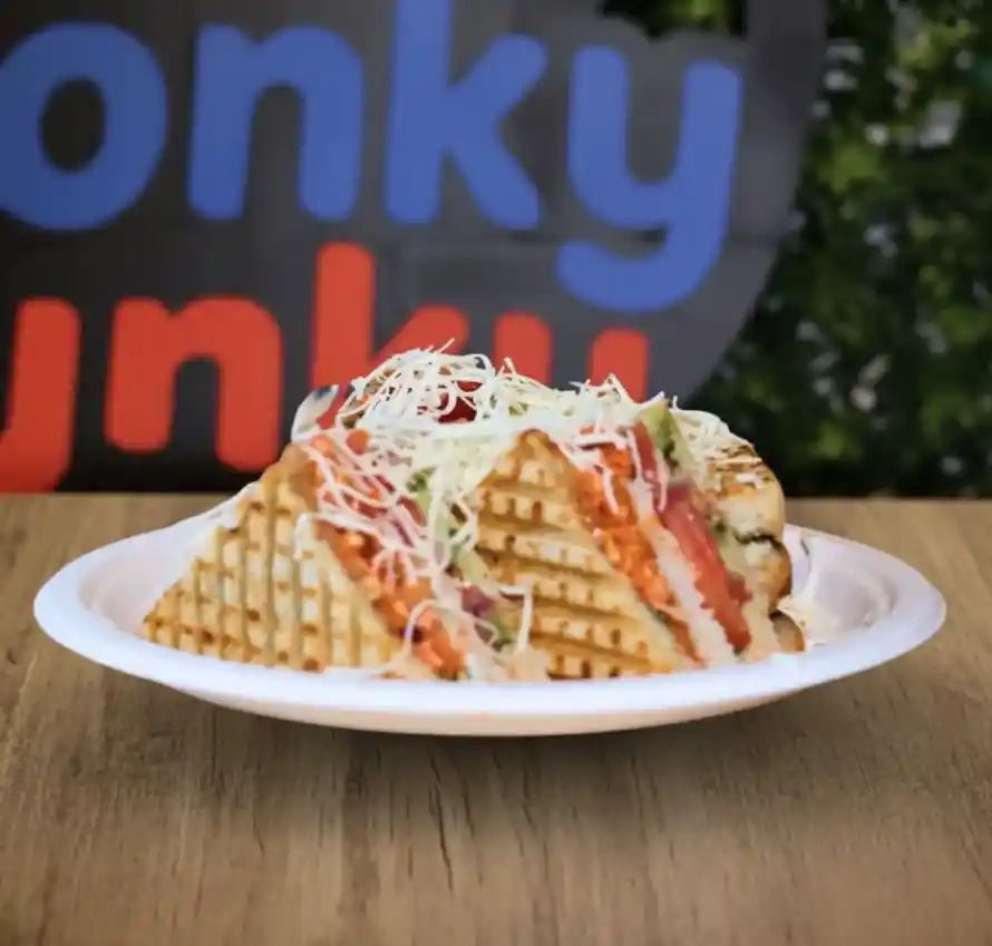 A club sandwich sitting on a plate.