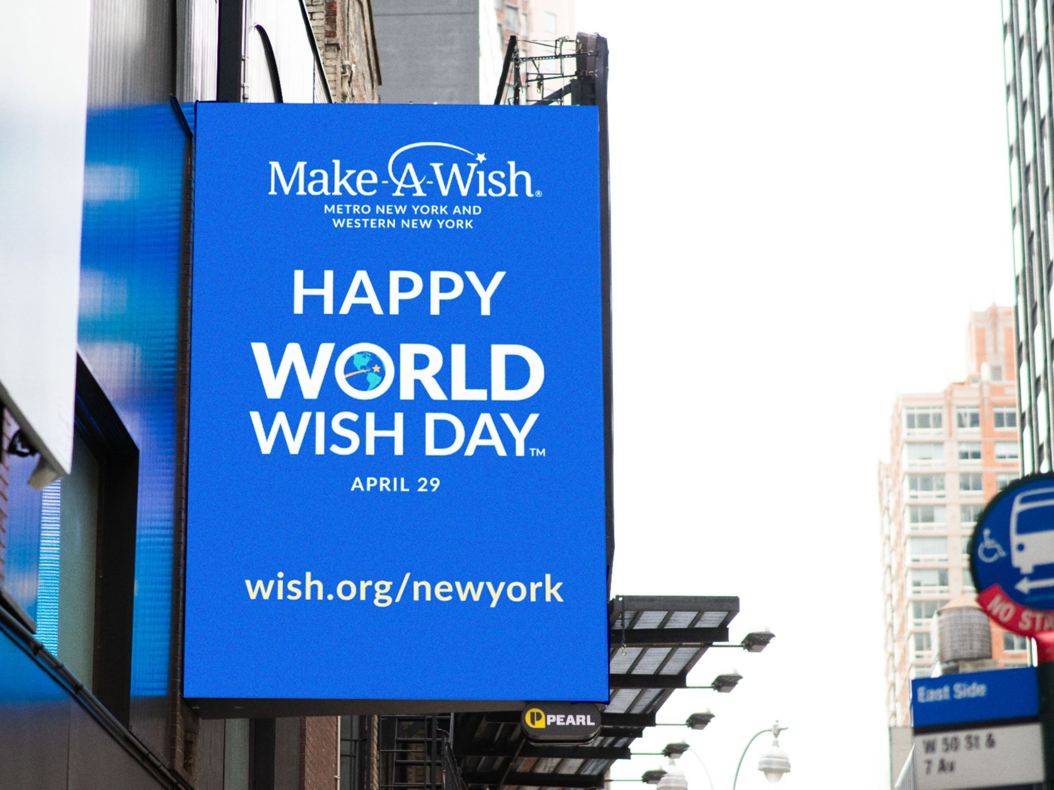 DOOH screen in NYC with Make-A-Wish advertisement