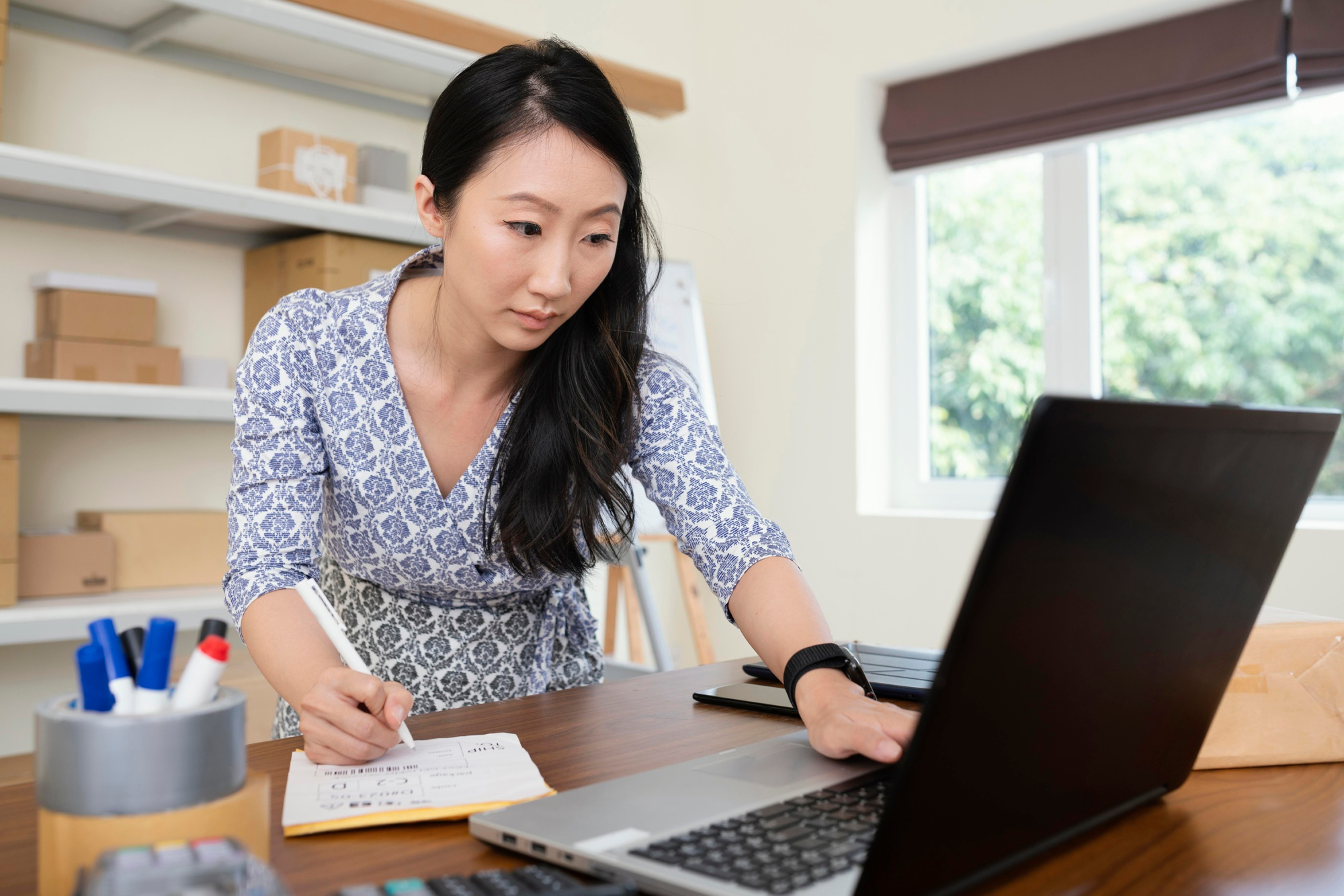 New small business owner learning startup accounting essentials from online bookkeeping and finance tools.