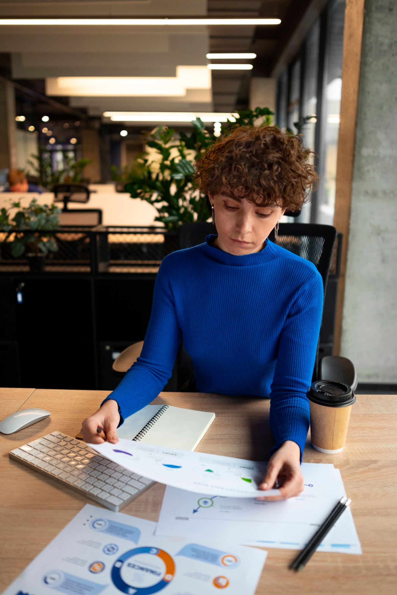 First-time SME entrepreneur in US analyzing small business financial statements and balance sheets.
