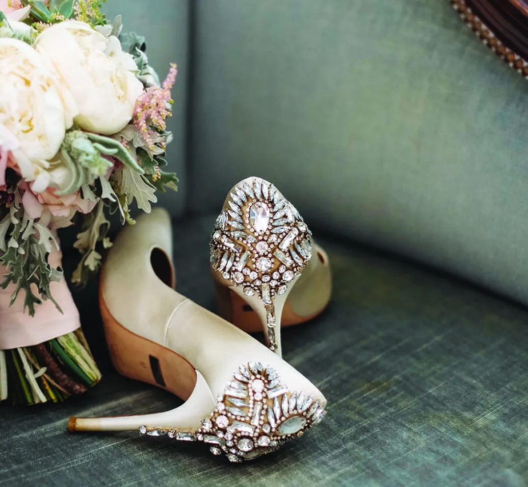 High heels next to flowers