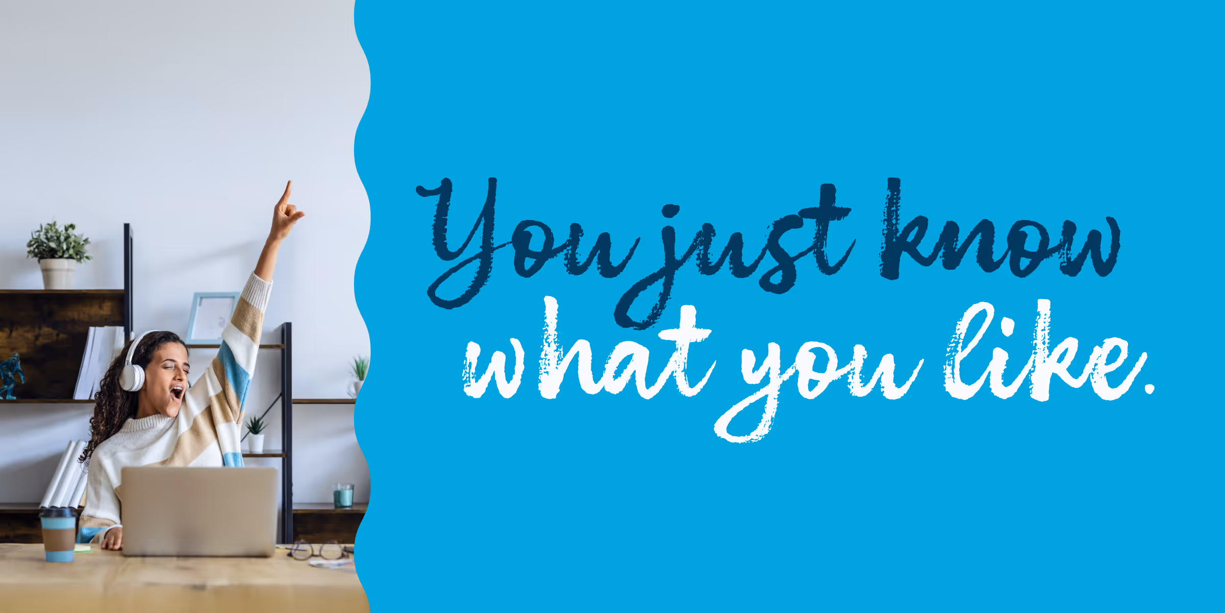 woman using a laptop using headphones jamming to some music