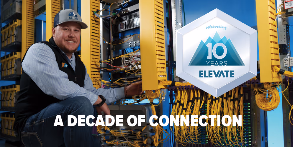 Image of Taylor Katzer, Elevate Broadband Field Operations Manager in front of a network rack