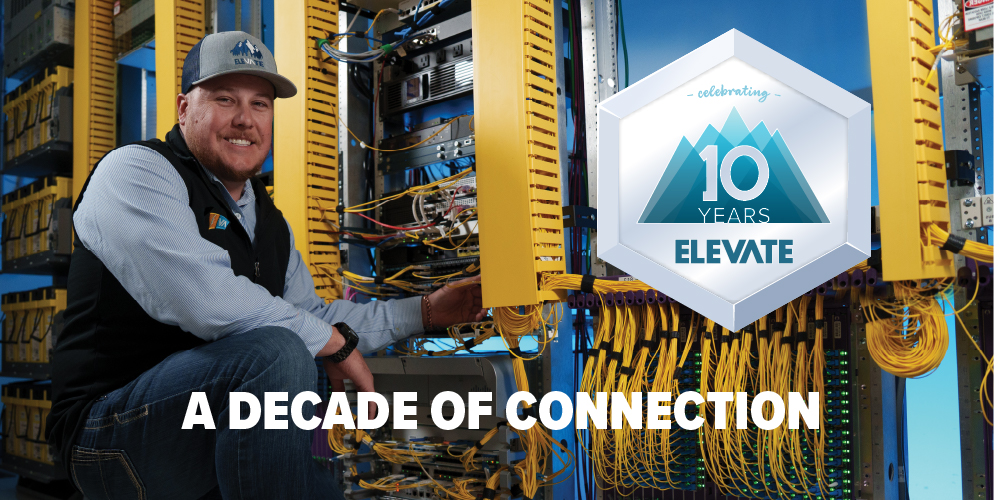 Image of Taylor Katzer, Elevate Broadband Field Operations Manager in front of a network rack