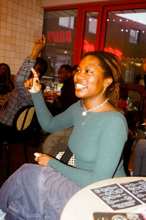 A group of black, female, footballers taking a team photograph