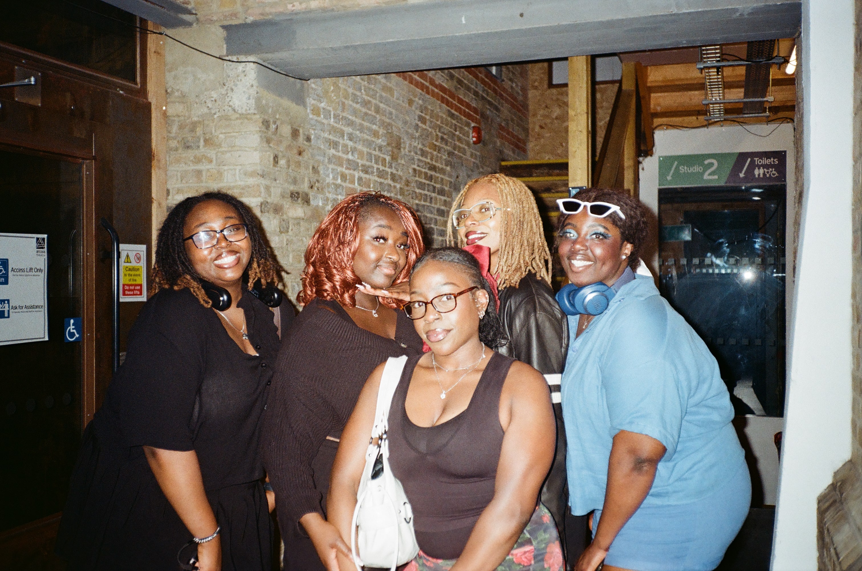 A group of black, female, footballers taking a team photograph