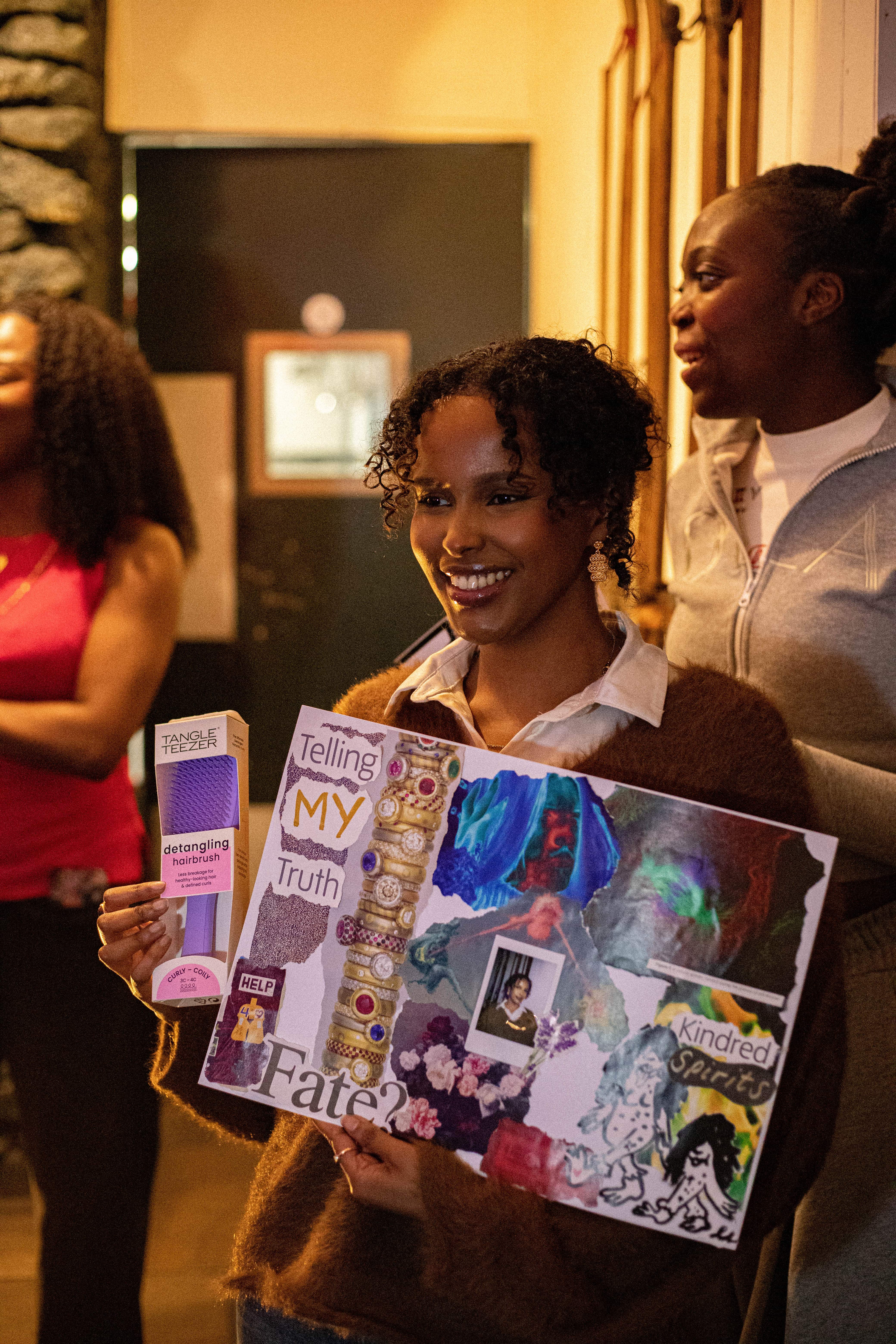 A group of black, female, footballers taking a team photograph