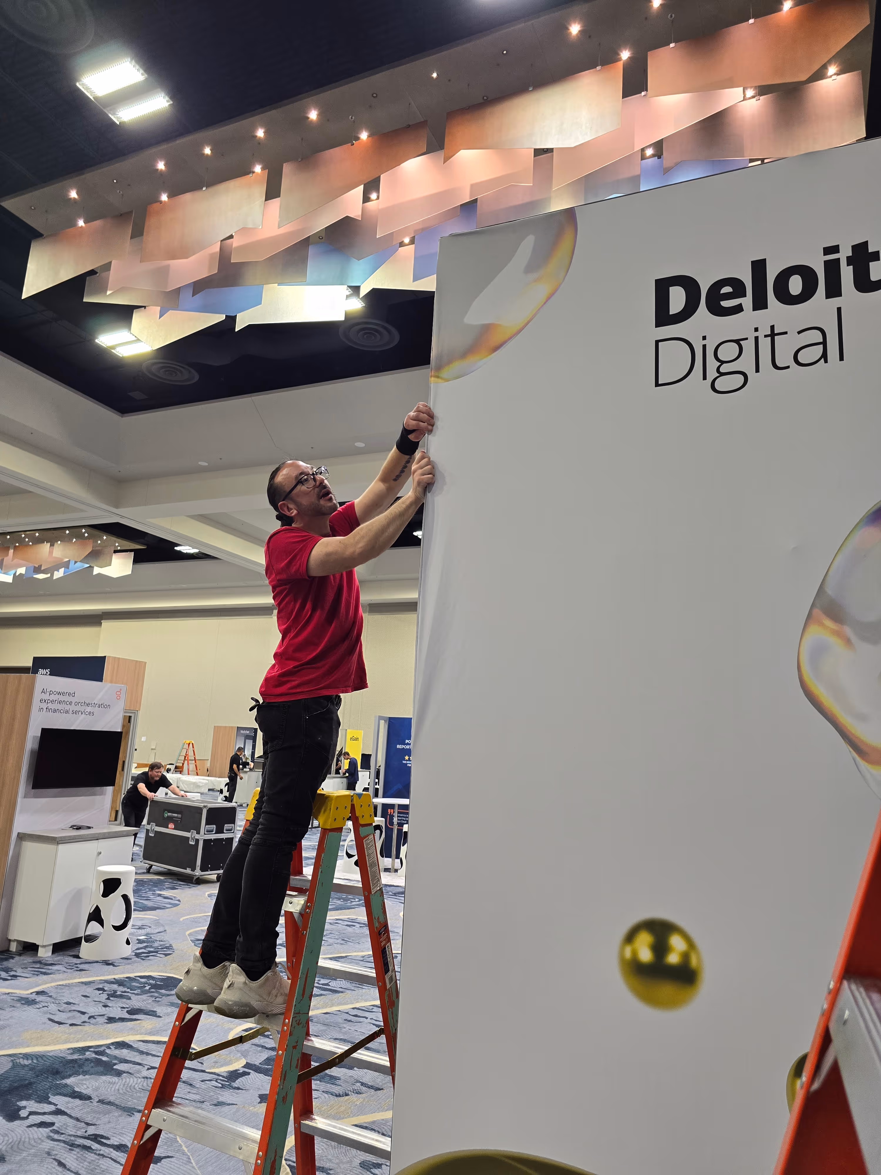 Laborjack setting up event signage