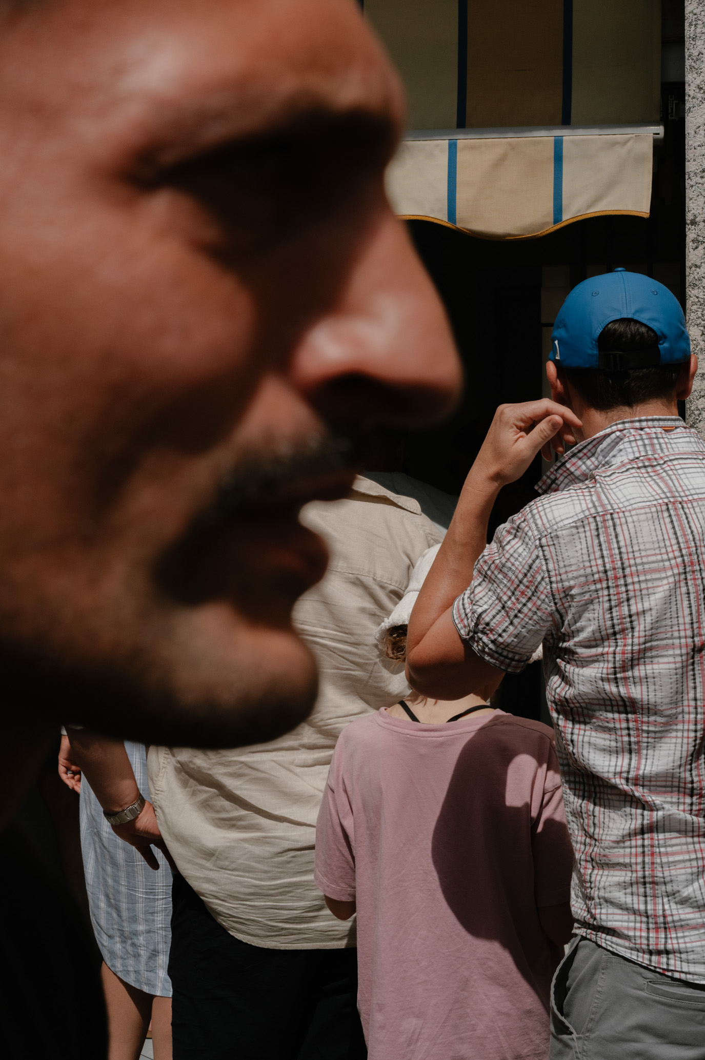 People waiting in line for ice cream in Como Italy
