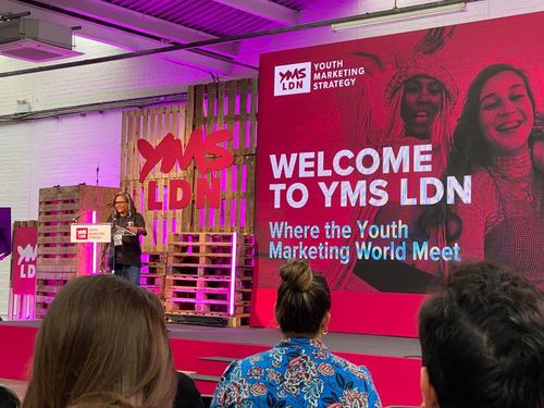 Female speaker on stage at YMS LDN