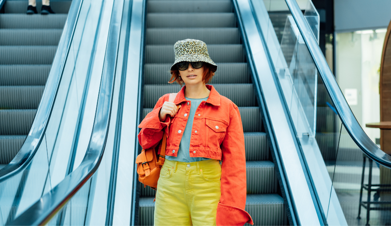 girl on shopping center escalator