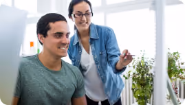 Two people talking in an office