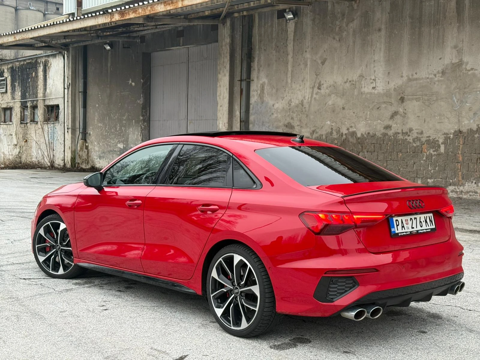 Rear view of the Audi S3 in a car park showing the quad exhaust pipes