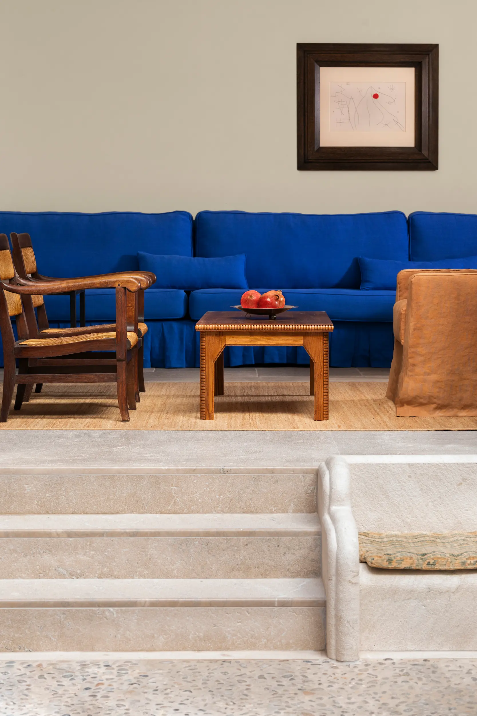 A beautiful pop of blue on the lounge sofa brightens the space