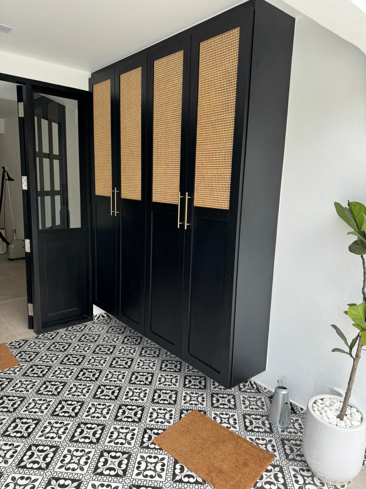 Custom Colonial Black Cabinet with Rattan Fittings.