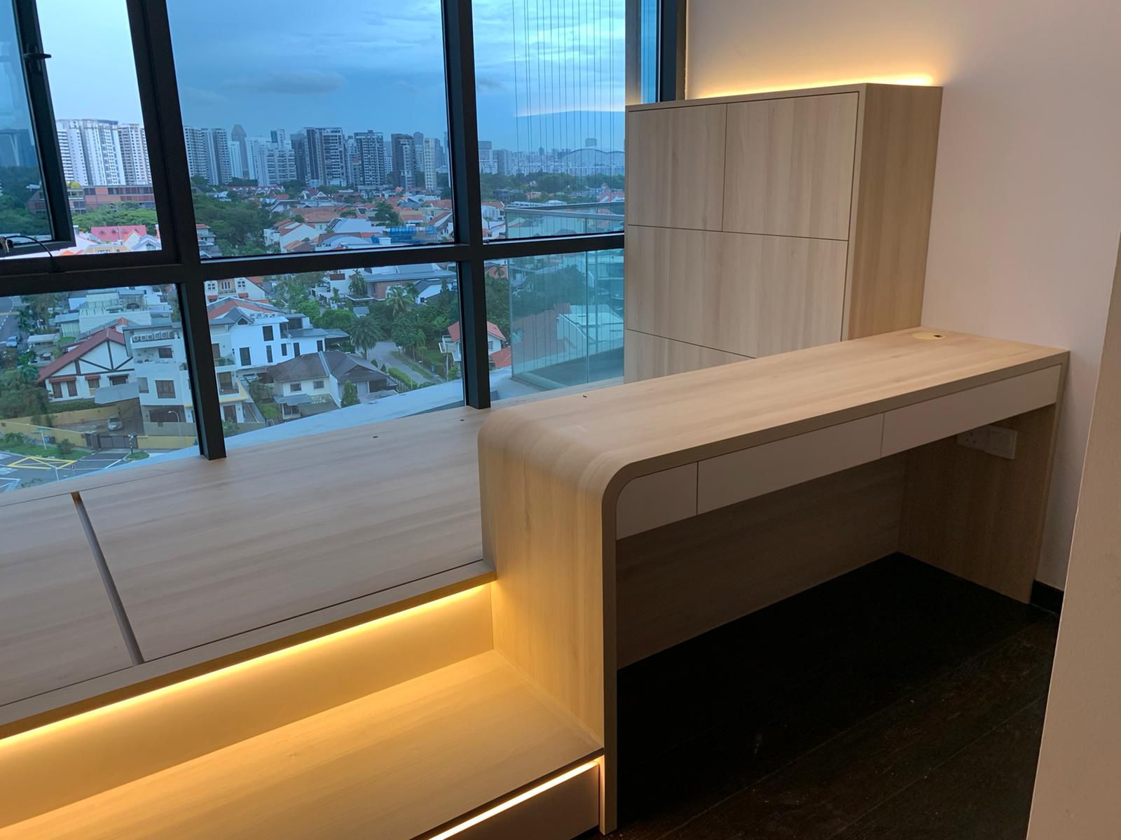 Custom platform bed with steps, table, cabinet and light fixtures
