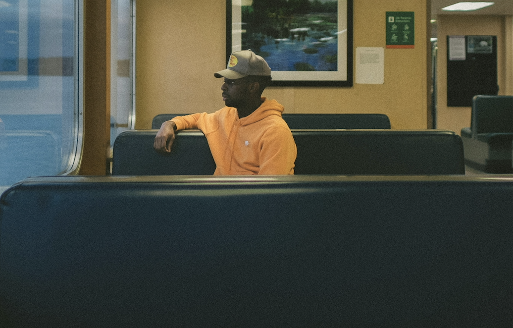 Man looking out window